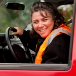 Melanie driving a truck