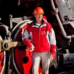 Rick Corman standing in front of the Old Smokey steam locomotive
